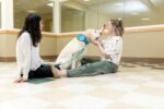 Therapy dog Ajax with two female patients