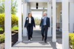 Dr. Wasser and Eleanor Cronley walking outside